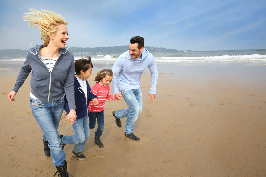 picture of Family running on the beach